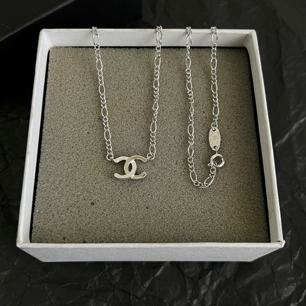 Double-C Emblem Pendant Necklace in Polished Metal-Tone – Design 066 close-up detail