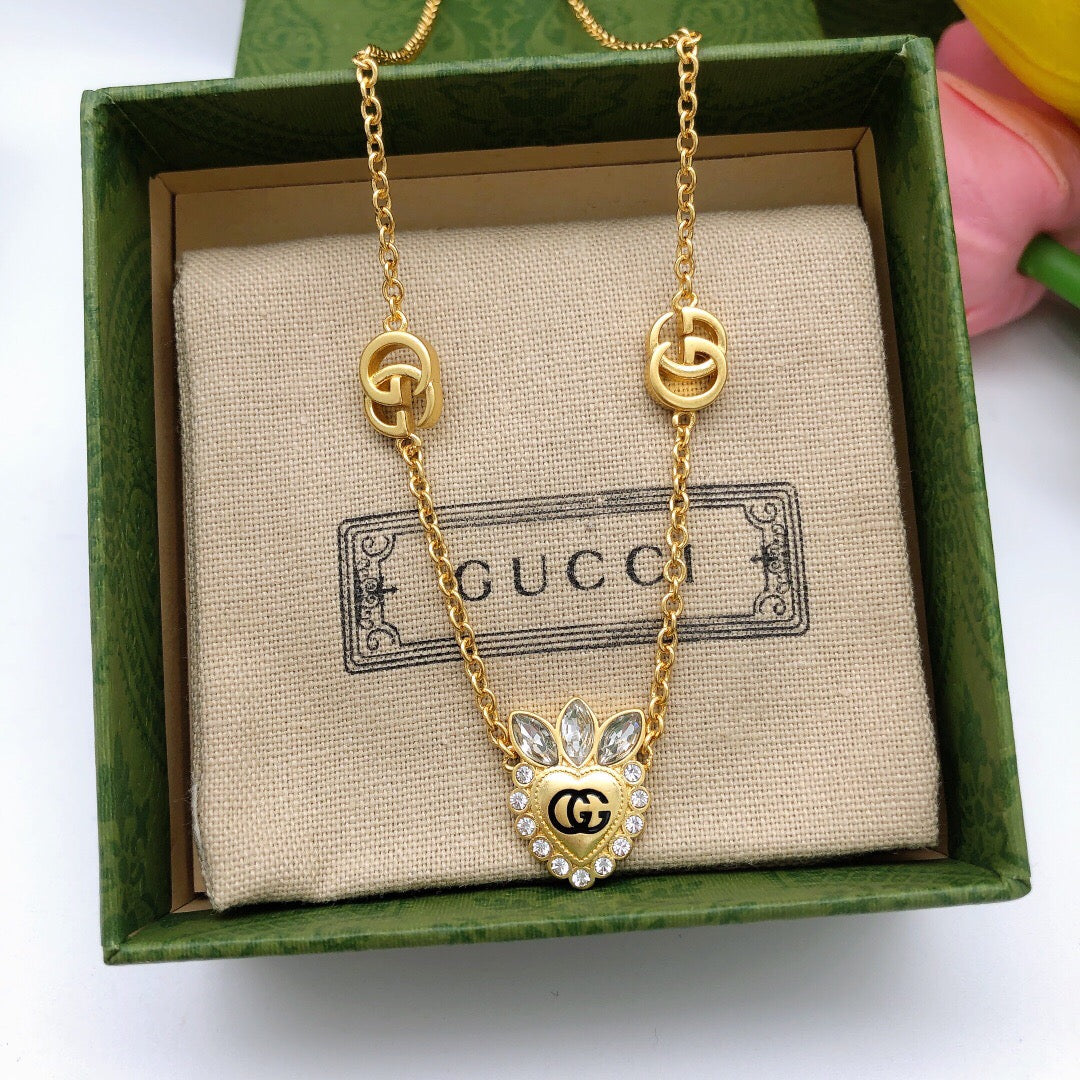 Double-G Emblem Pendant Necklace in Polished Metal-Tone – Crystal Detail – Design 005 side detail