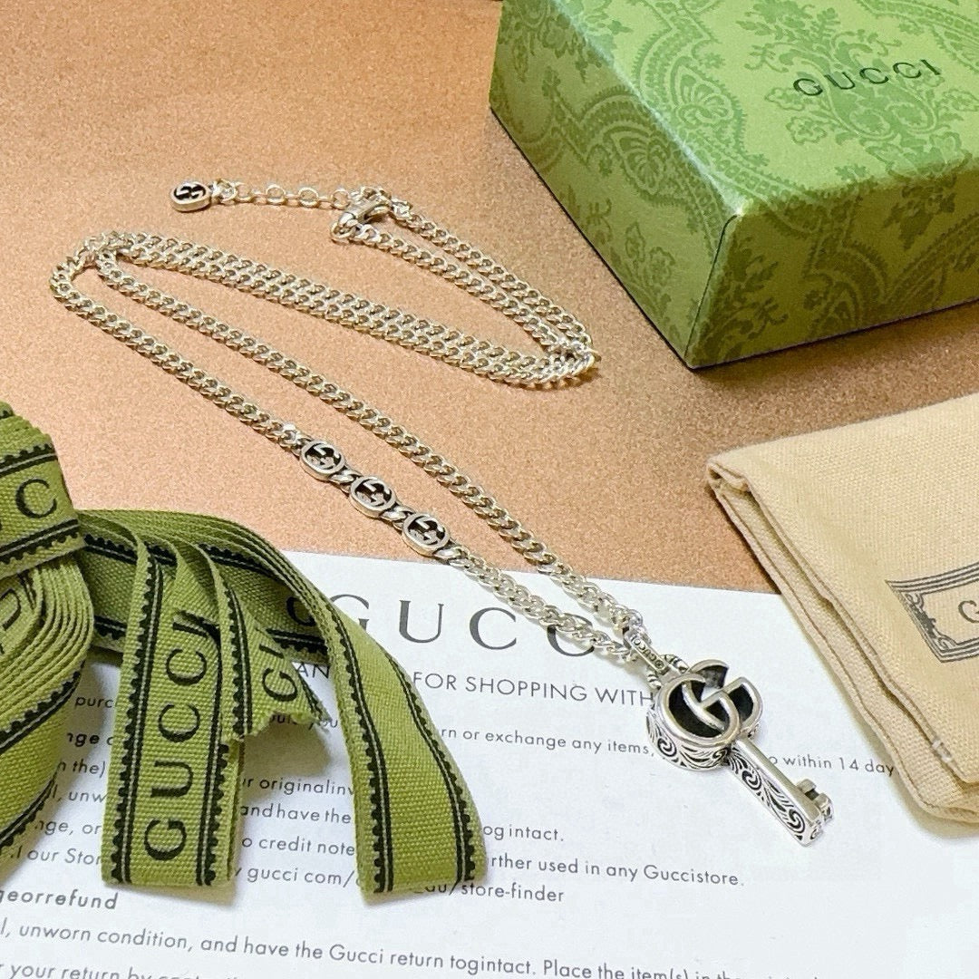 Double-G Emblem Pendant Necklace in Polished Metal-Tone – Vintage Detail – Design 055 close-up detail