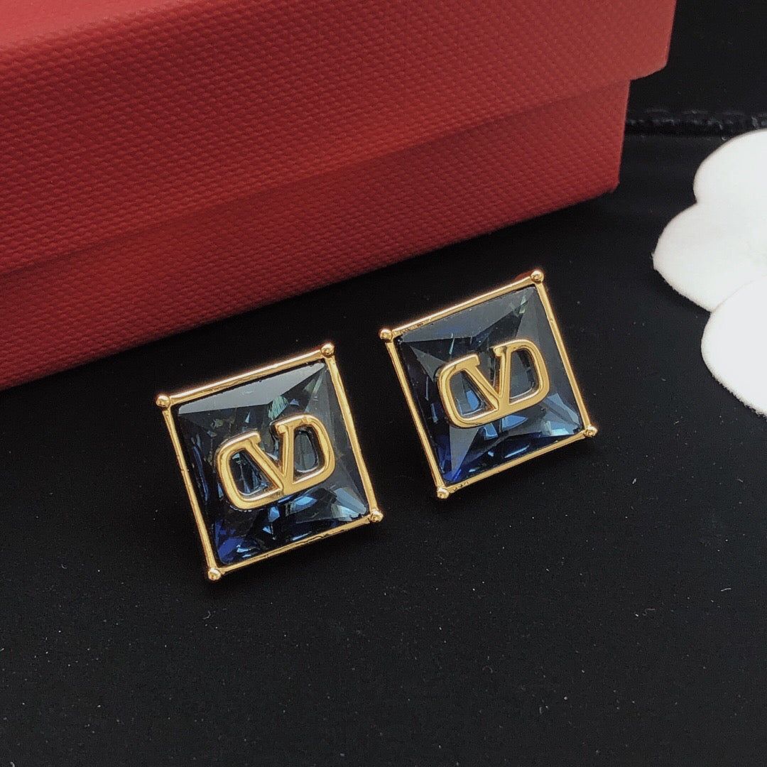 Signature Emblem Stud Earrings in Polished Metal-Tone – Red side detail
