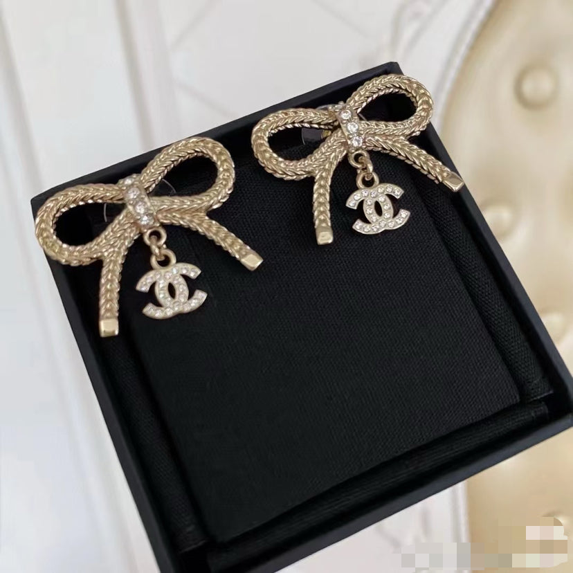 Double-C Emblem Stud Earrings in Polished Metal-Tone – Design 306 detail view