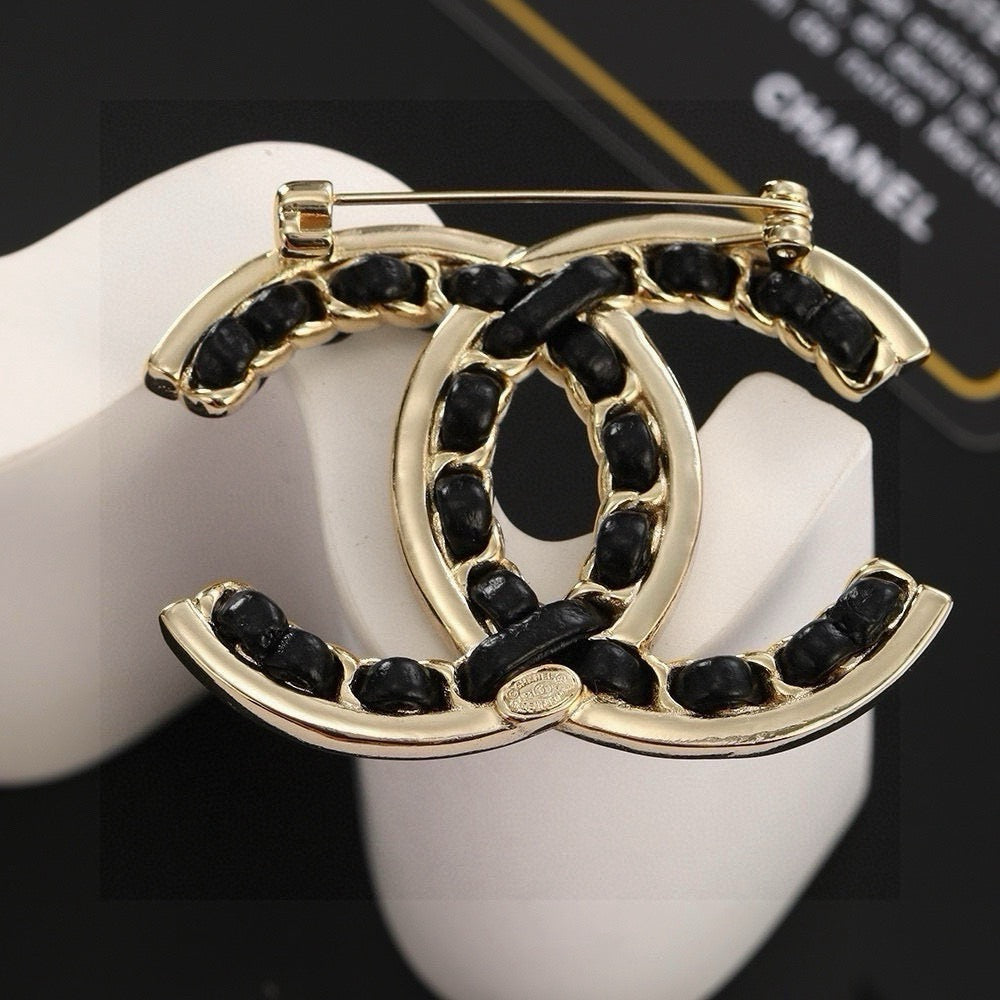 Double-C Emblem Brooch in Polished Metal-Tone – Black Detail styled product view