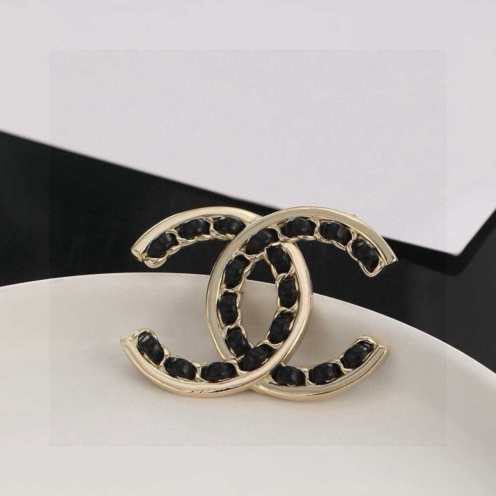 Double-C Emblem Brooch in Polished Metal-Tone – Black Detail – Design 002 front product view