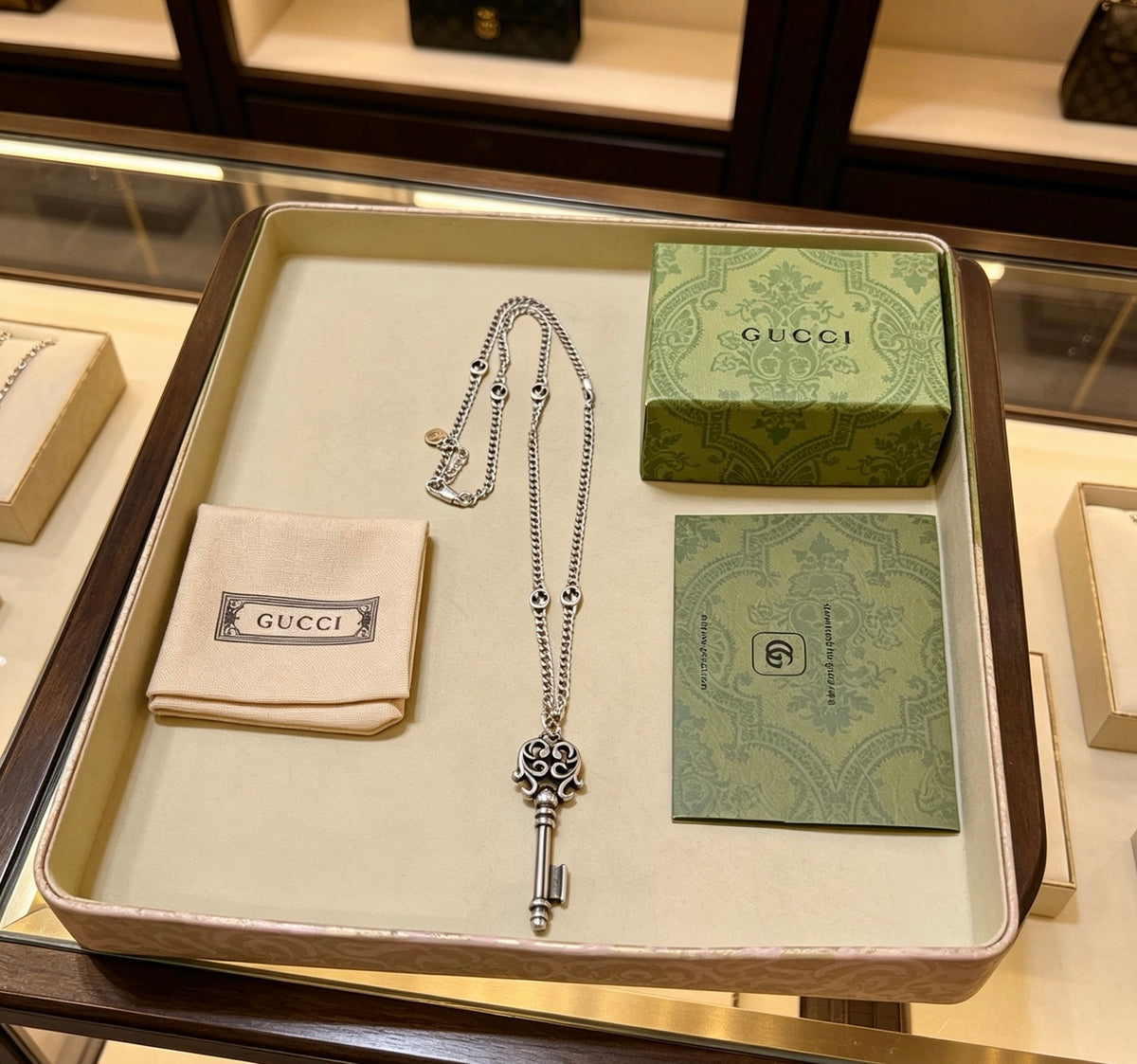 Double-G Emblem Pendant Necklace in Polished Metal-Tone – Vintage Detail – Design 045 close-up detail