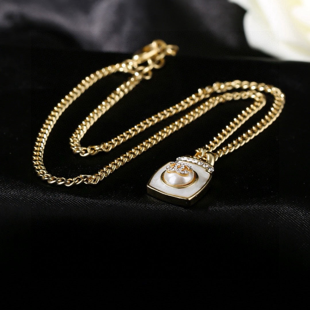 Double-C Emblem Pendant Necklace in Gold-Tone – Design 021 detail view