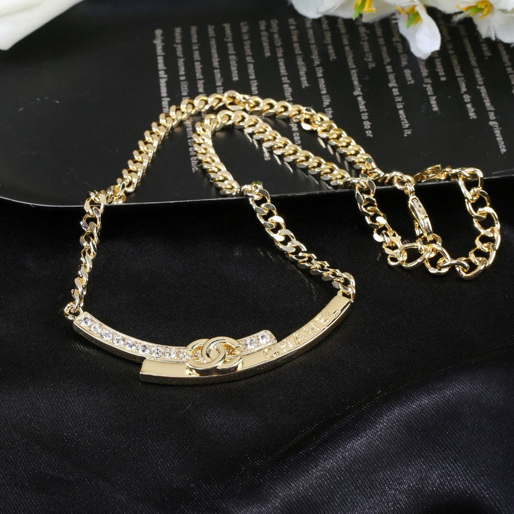 Double-C Emblem Pendant Necklace in Polished Metal-Tone – White Detail detail view