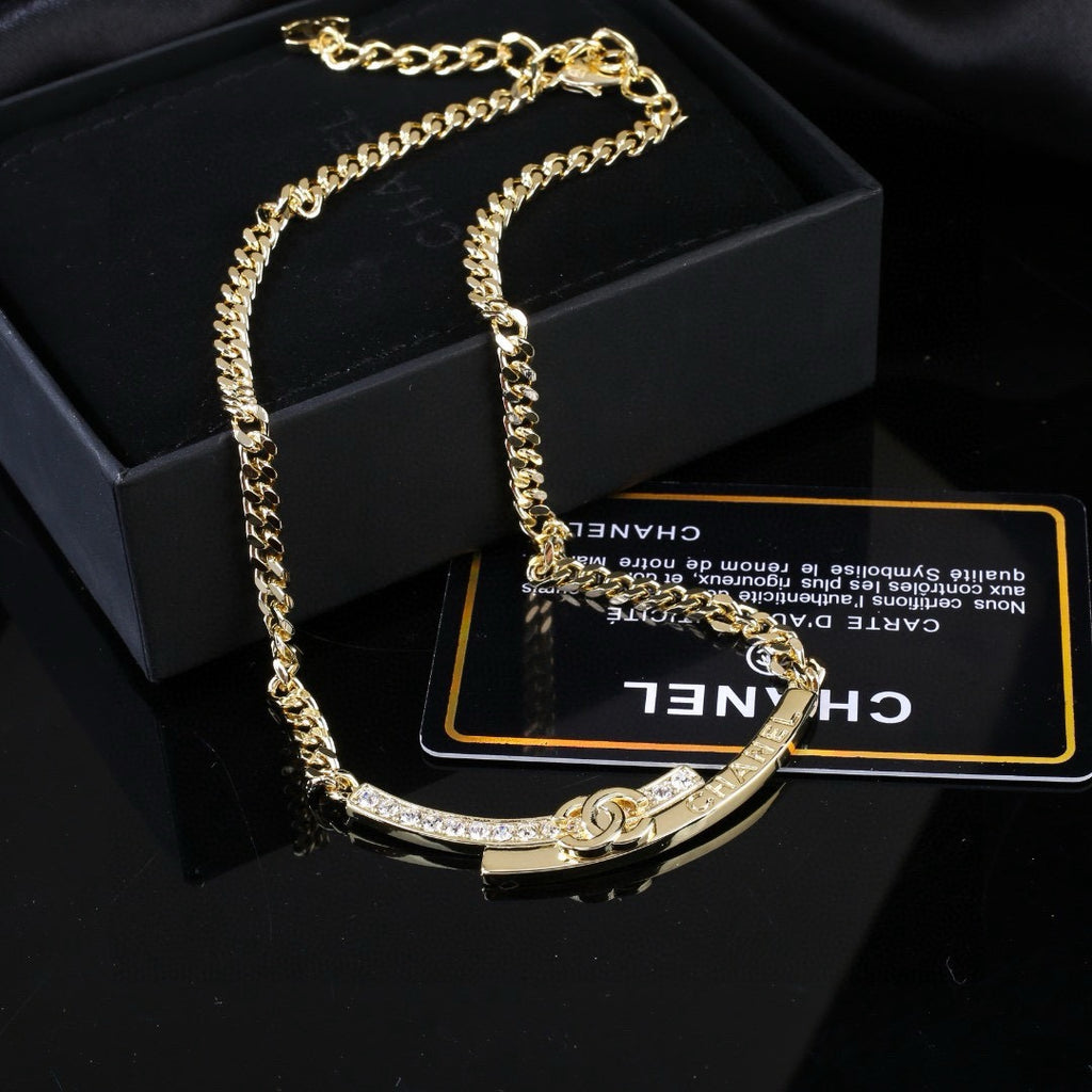 Double-C Emblem Pendant Necklace in Polished Metal-Tone – White Detail front product view