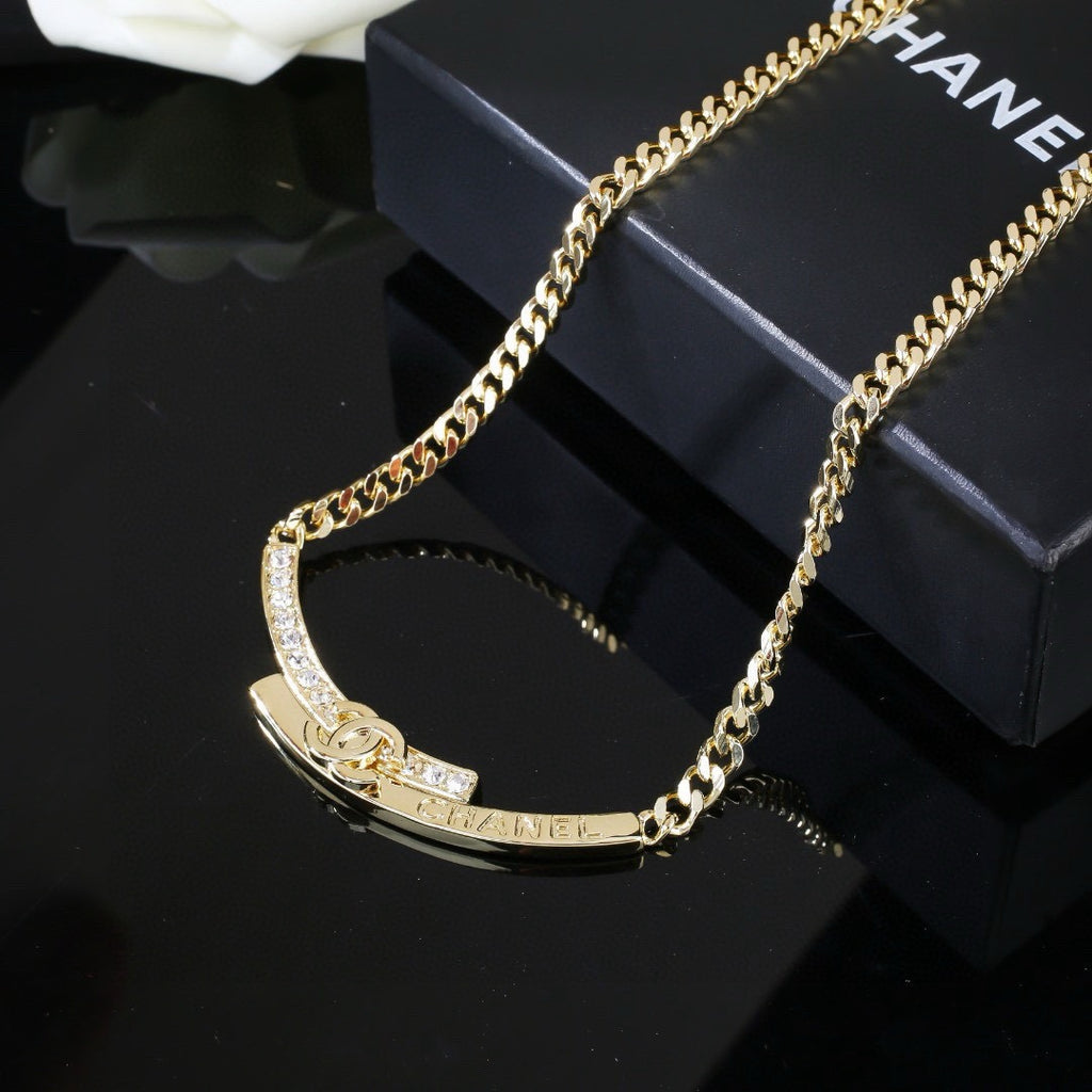 Double-C Emblem Pendant Necklace in Polished Metal-Tone – White Detail main product view