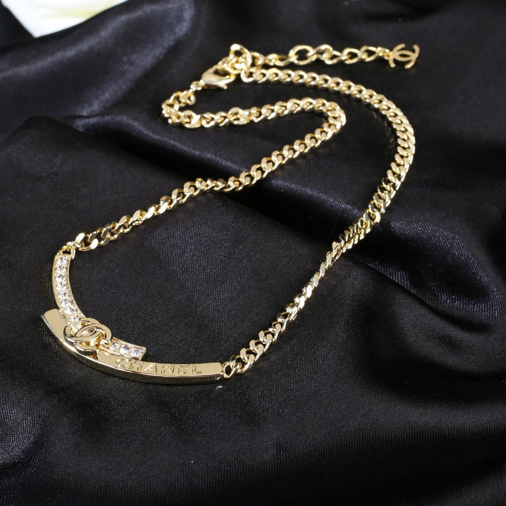 Double-C Emblem Pendant Necklace in Polished Metal-Tone – White Detail styled product view