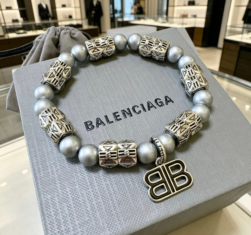 Geometric Emblem Bracelet in Polished Metal-Tone – Pearl Detail close-up detail
