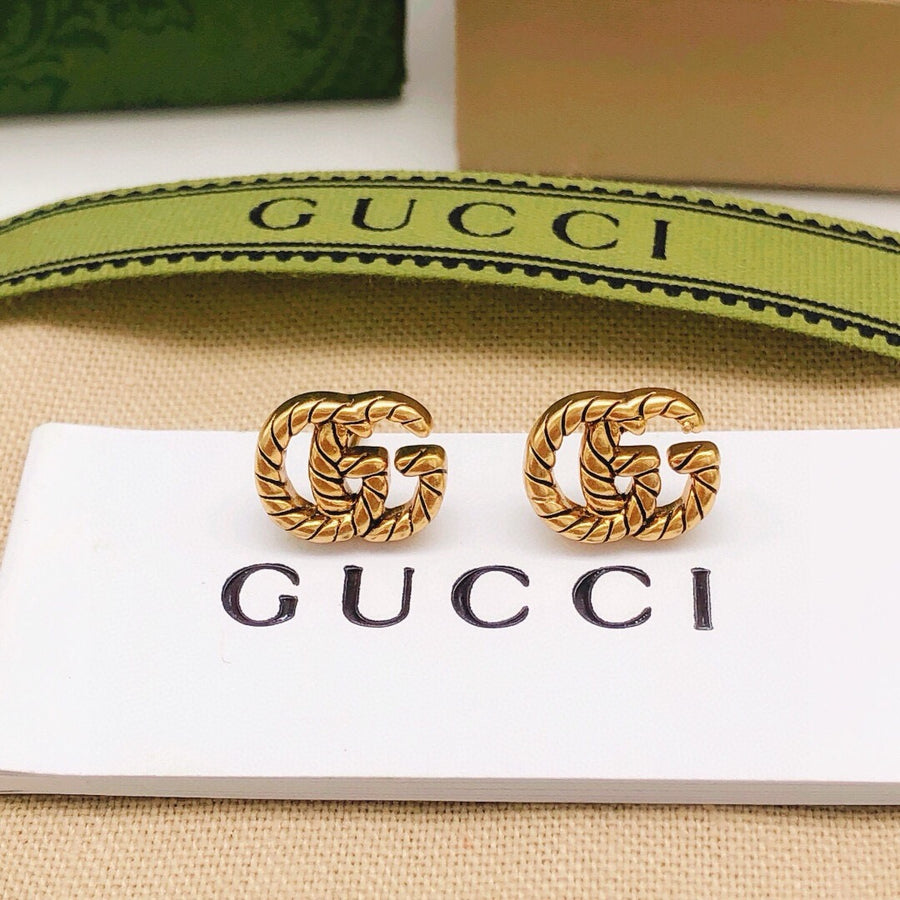 Double-G Emblem Stud Earrings in Polished Metal-Tone – Design 034 main product view