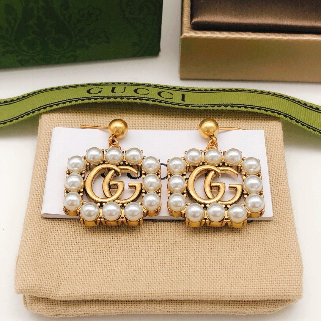 Geometric Emblem Stud Earrings in Polished Metal-Tone – Design 050 front product view