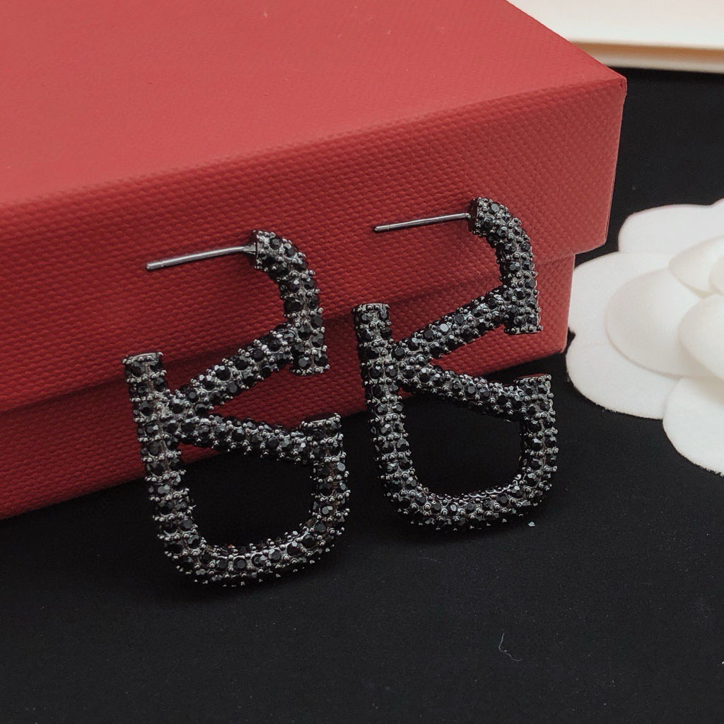 Signature Emblem Crystal-Accent Stud Earrings – Black – Design 03 close-up view