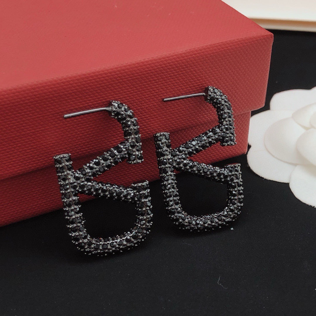 Signature Emblem Crystal-Accent Stud Earrings – Black – Design 03 close-up view