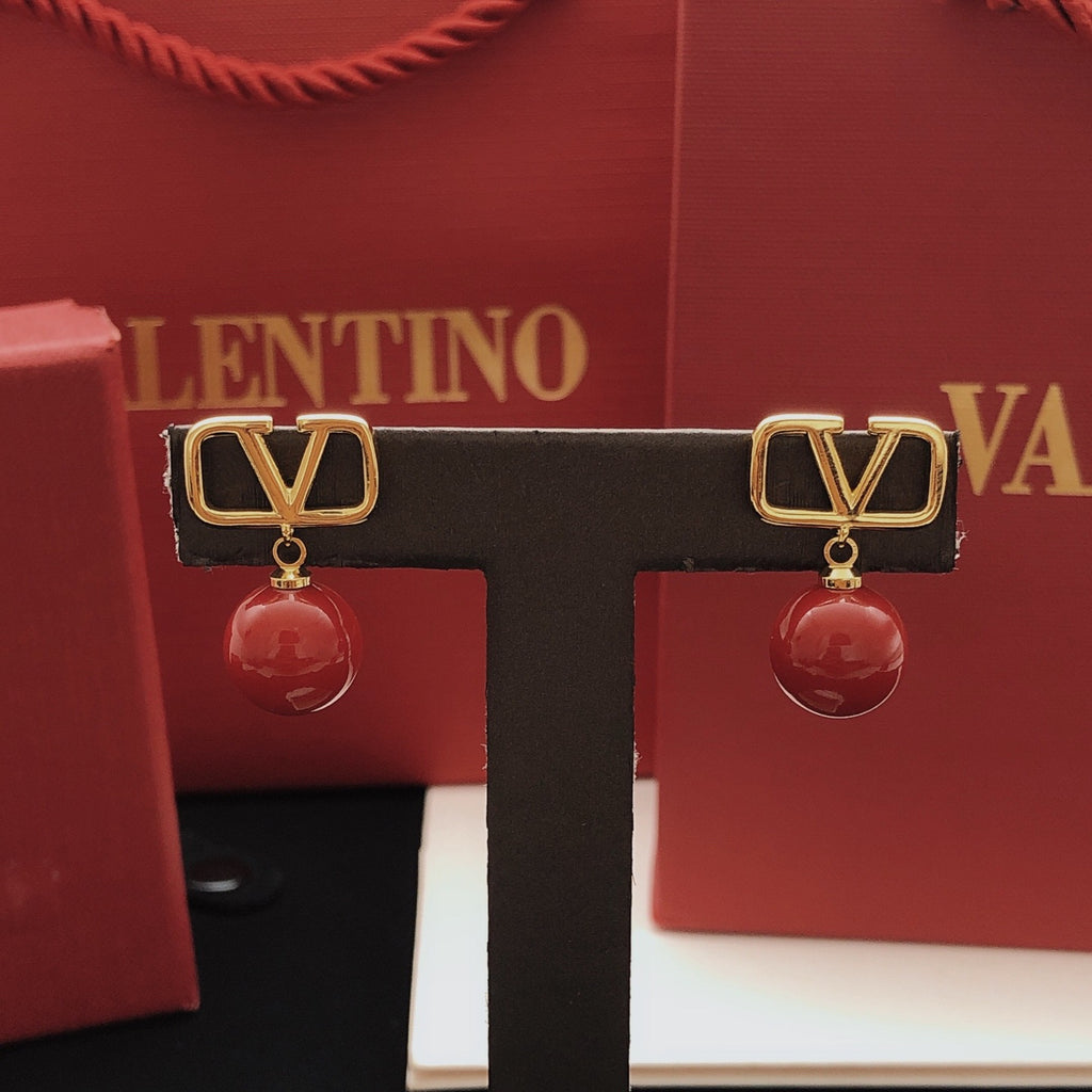 Signature Emblem Pearl-Detail Stud Earrings – Red close-up view