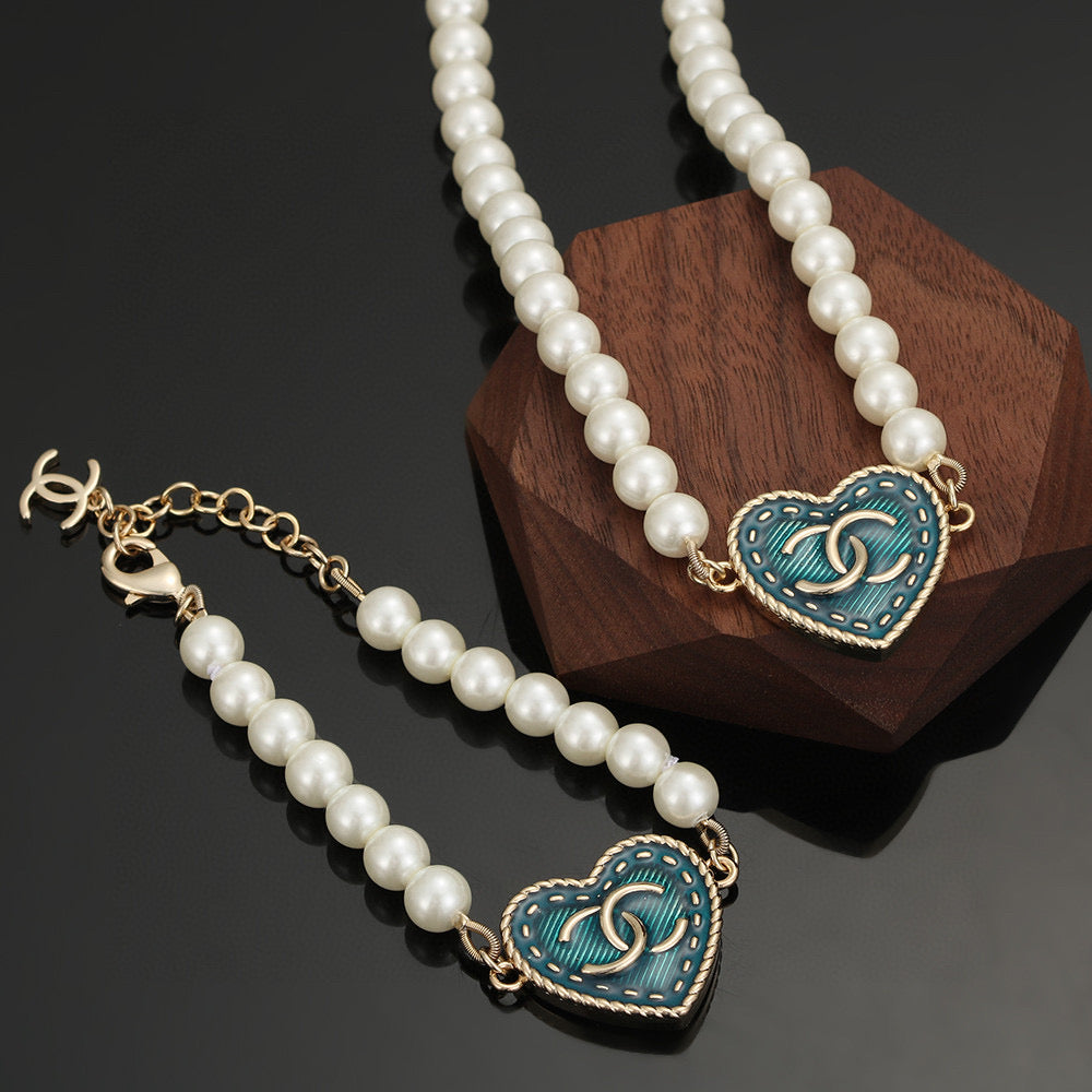 Double-C Emblem Bracelet in Polished Metal-Tone – Pearl Detail – Design 004 main product view