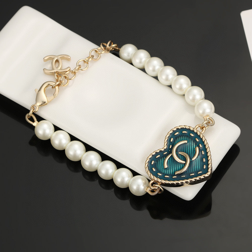 Double-C Emblem Bracelet in Polished Metal-Tone – Pearl Detail – Design 003 close-up detail