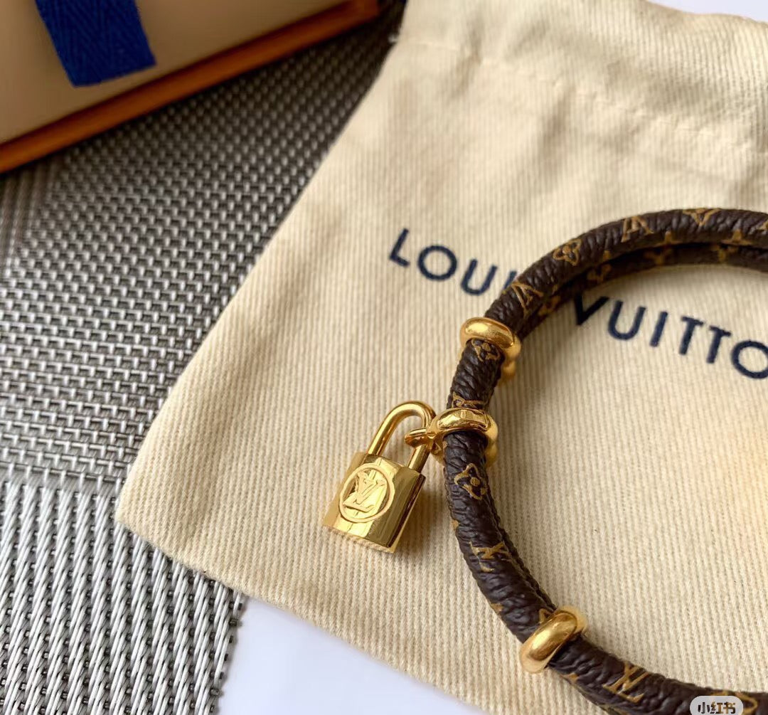 Letter Emblem Bangle in Polished Metal-Tone – Leather Detail – Design 002 front product view