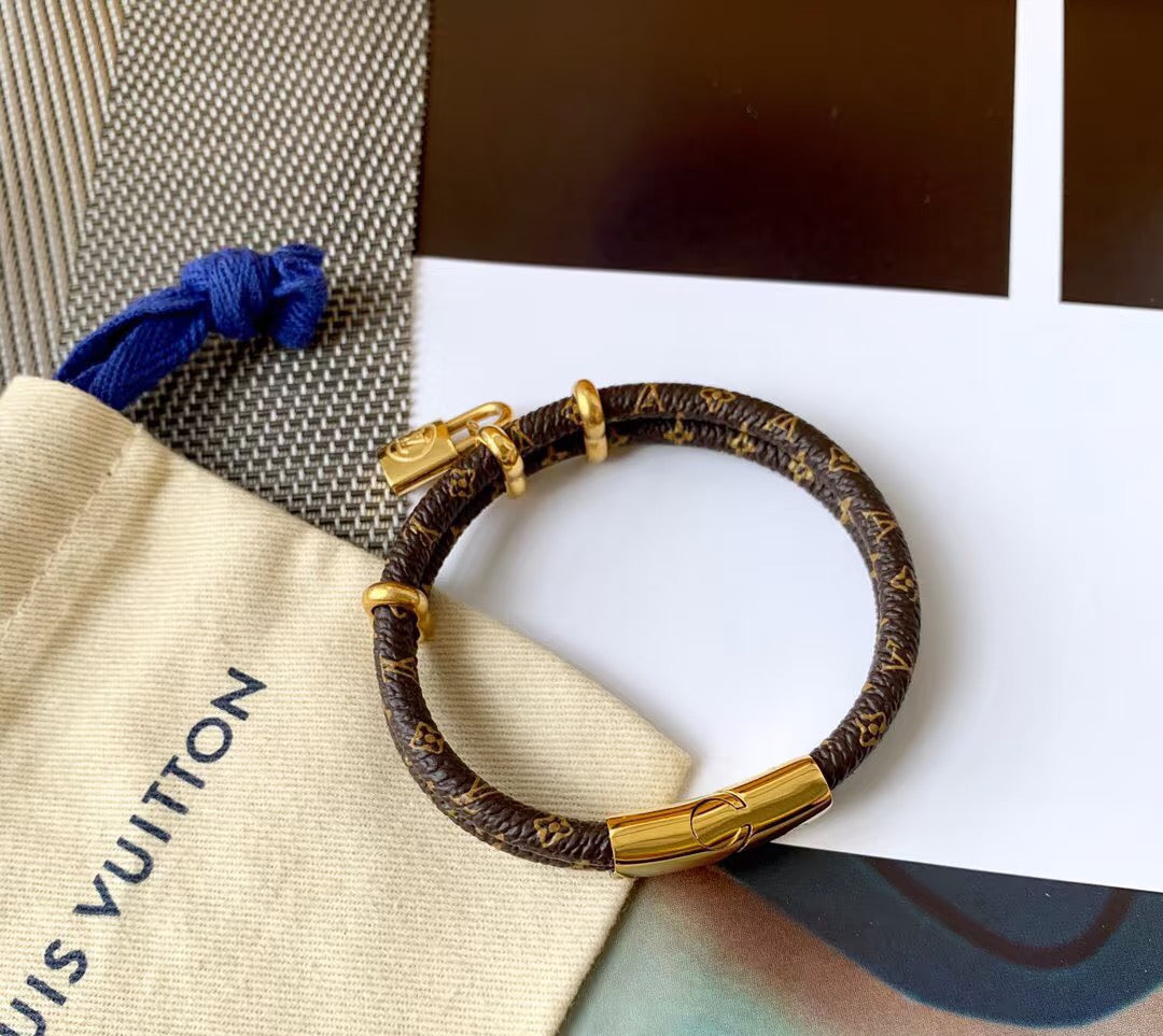 Letter Emblem Bangle in Polished Metal-Tone – Leather Detail – Design 002 main product view