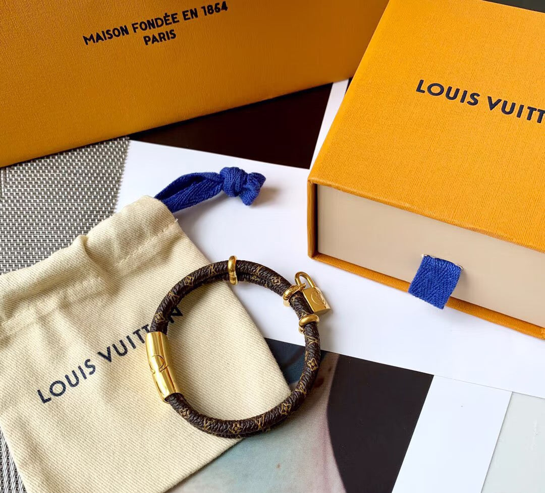 Letter Emblem Bangle in Polished Metal-Tone – Leather Detail close-up detail