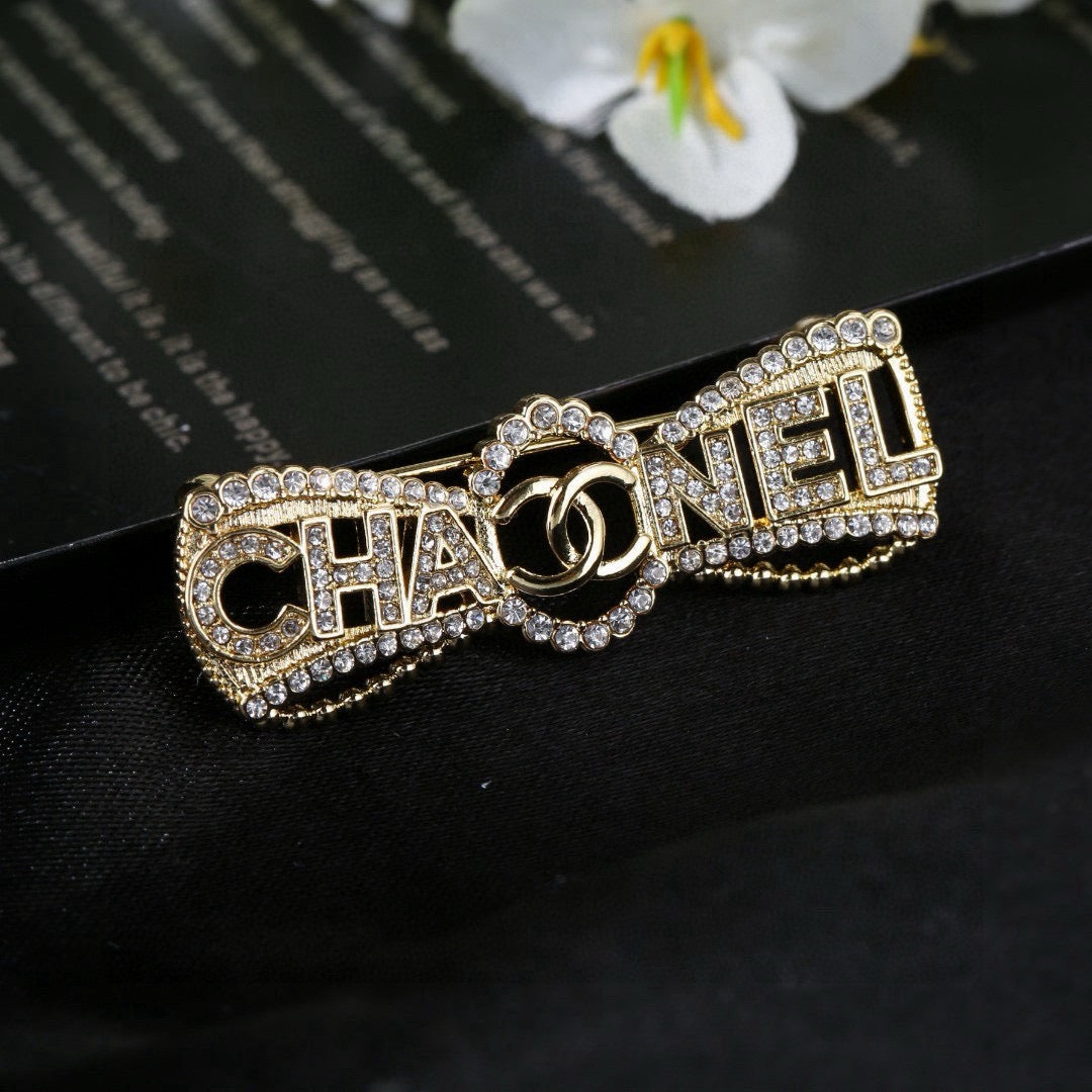 Double-C Emblem Brooch in Polished Metal-Tone – Design 019 close-up detail