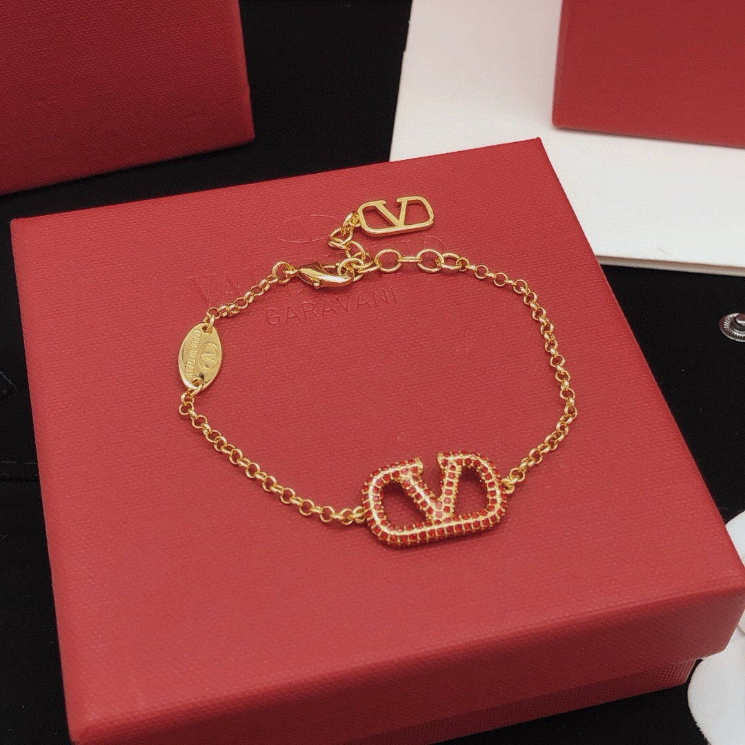 Signature Emblem Jewelry Accessory – Red detail view