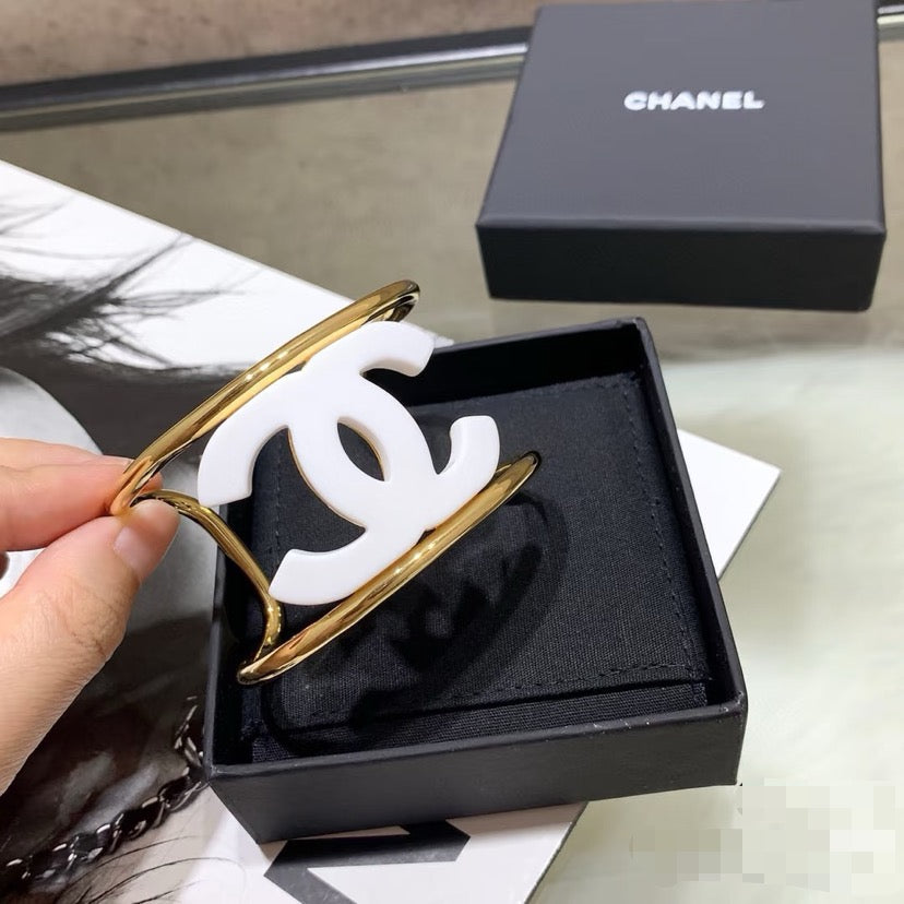 Signature Emblem Bangle in Polished Metal-Tone – White Detail – Design 006 front product view