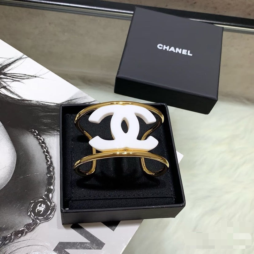 Signature Emblem Bangle in Polished Metal-Tone – White Detail – Design 005 main product view