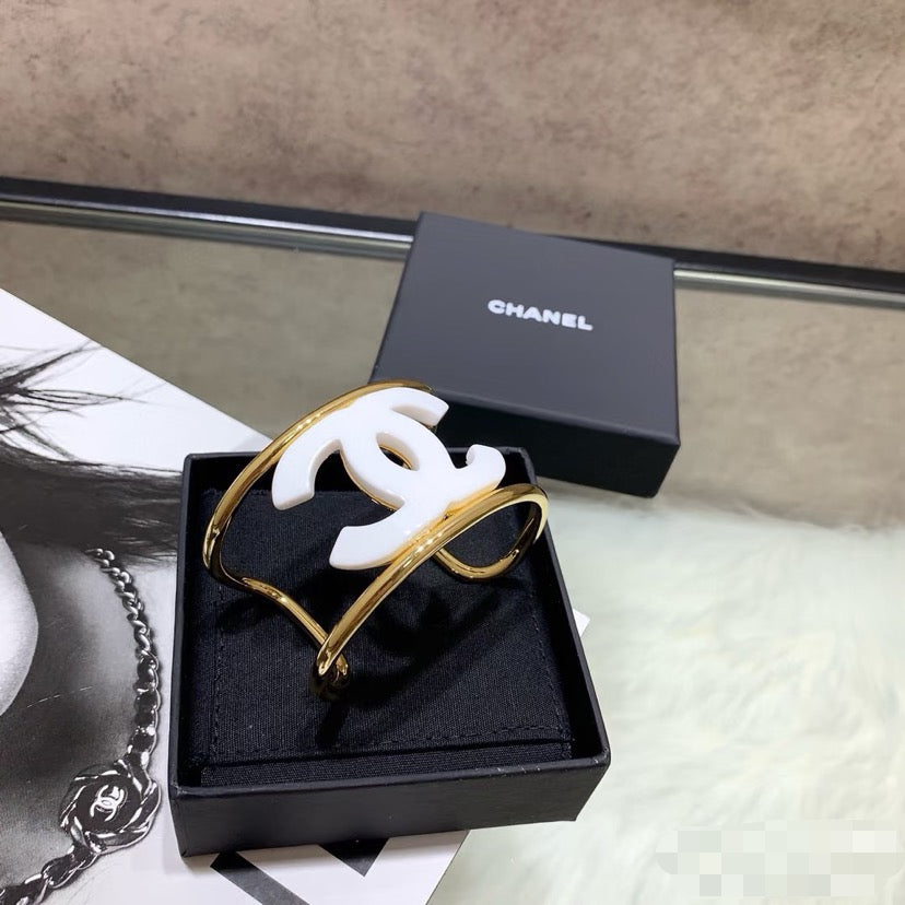 Signature Emblem Bangle in Polished Metal-Tone – White Detail – Design 006 detail view