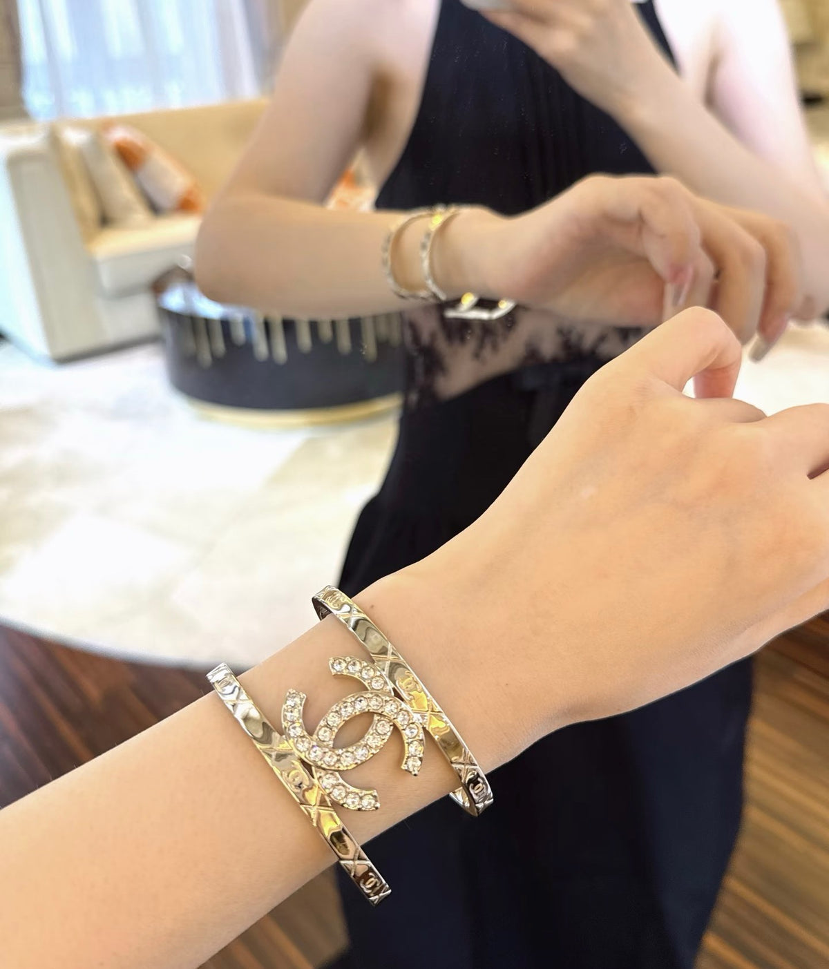 Signature Emblem Bangle in Polished Metal-Tone – Black Detail front product view