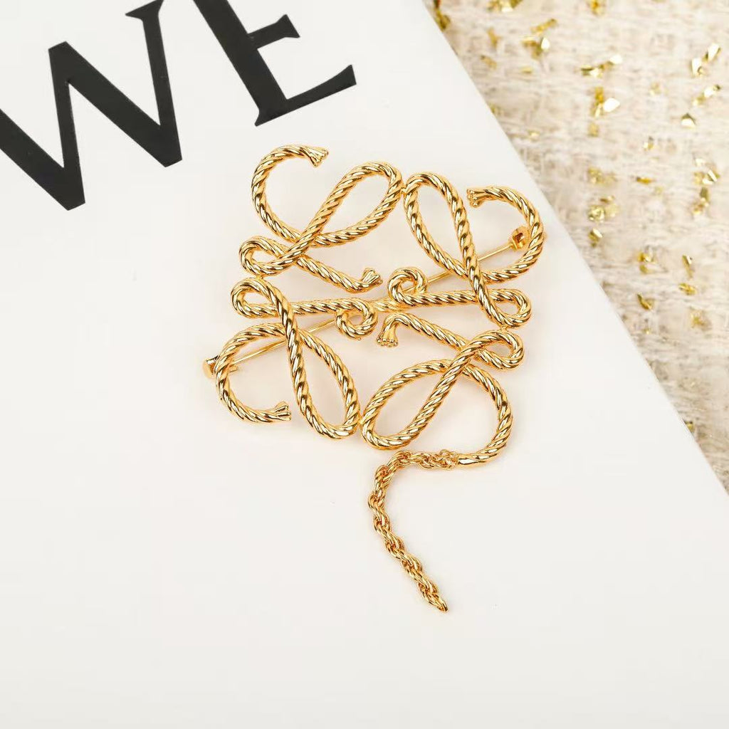 Signature Emblem Brooch in Polished Metal-Tone – Design 062 close-up detail