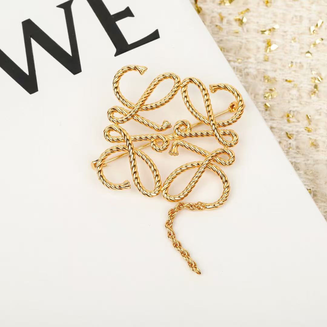 Signature Emblem Brooch in Polished Metal-Tone – Design 062 close-up detail