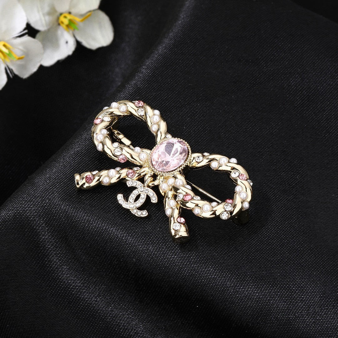 Double-C Emblem Brooch in Polished Metal-Tone – Pink Detail main product view
