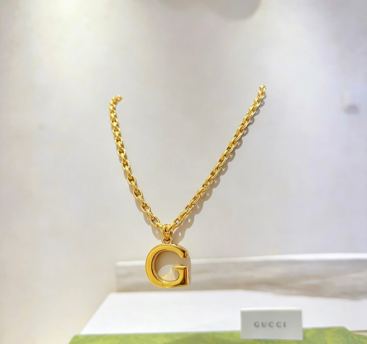 Double-G Emblem Pendant Necklace in Gold-Tone – Design 013 close-up detail