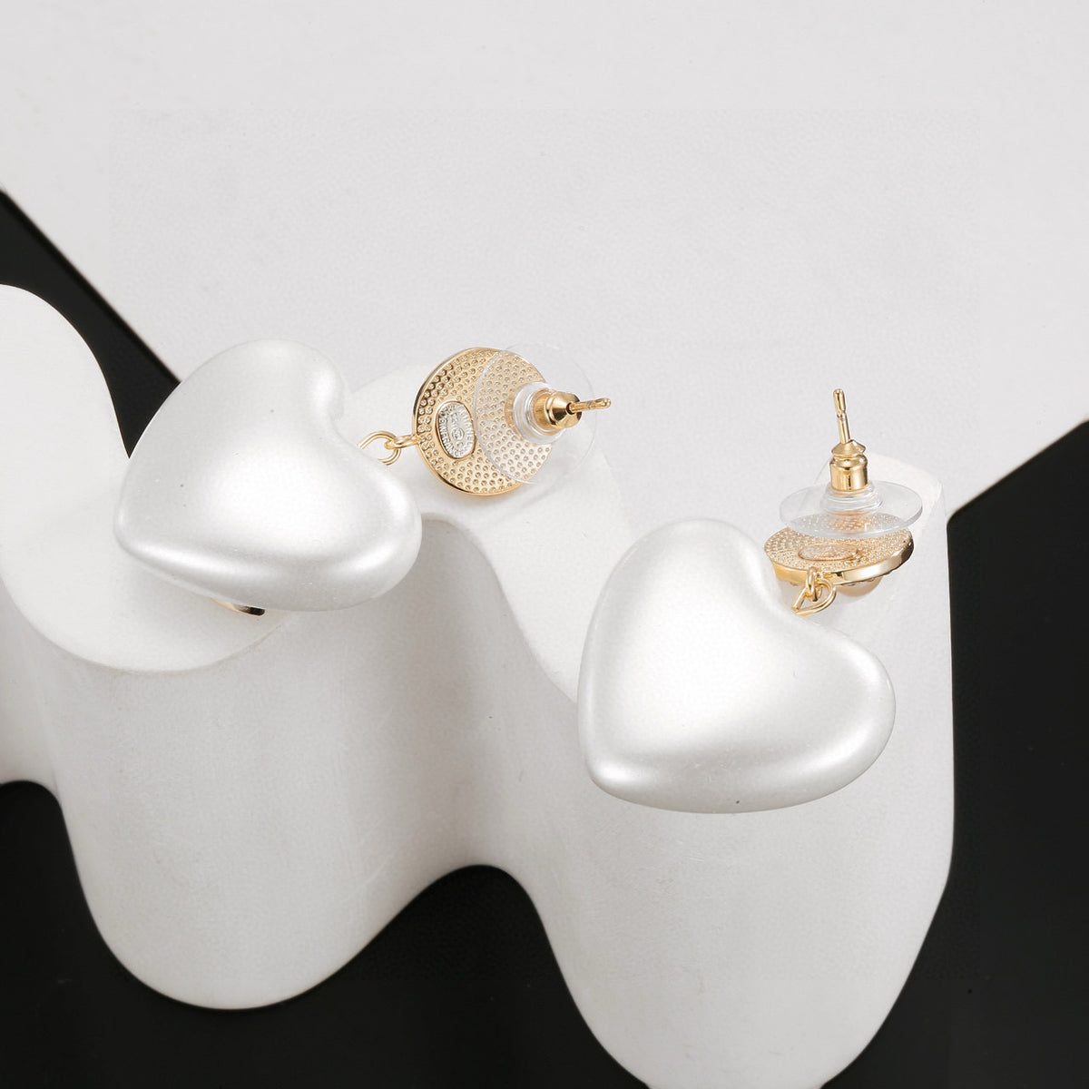 Signature Emblem Stud Earrings in Polished Metal-Tone – Design 017 detail view