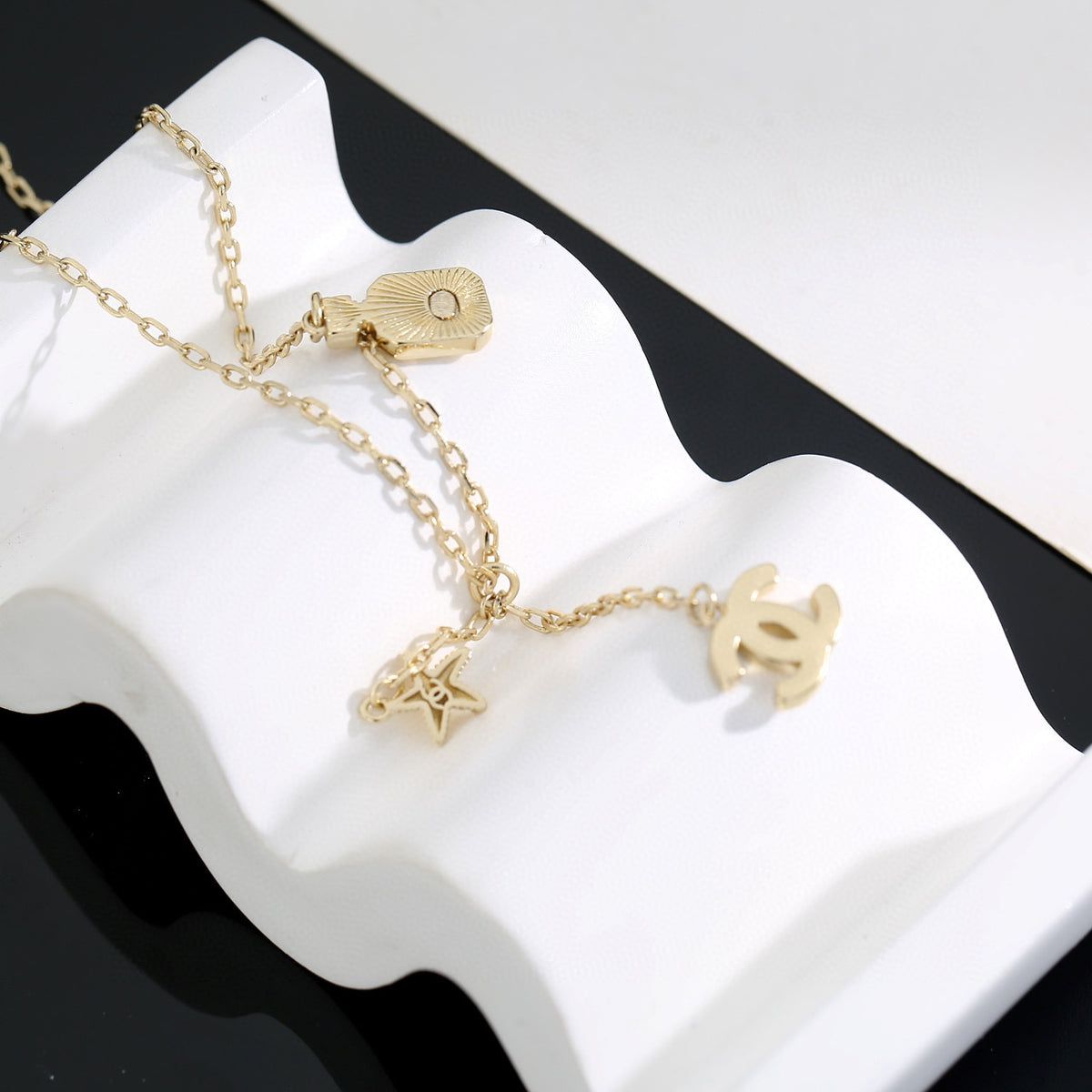 Double-C Emblem Pendant Necklace in Polished Metal-Tone – Design 010 front product view