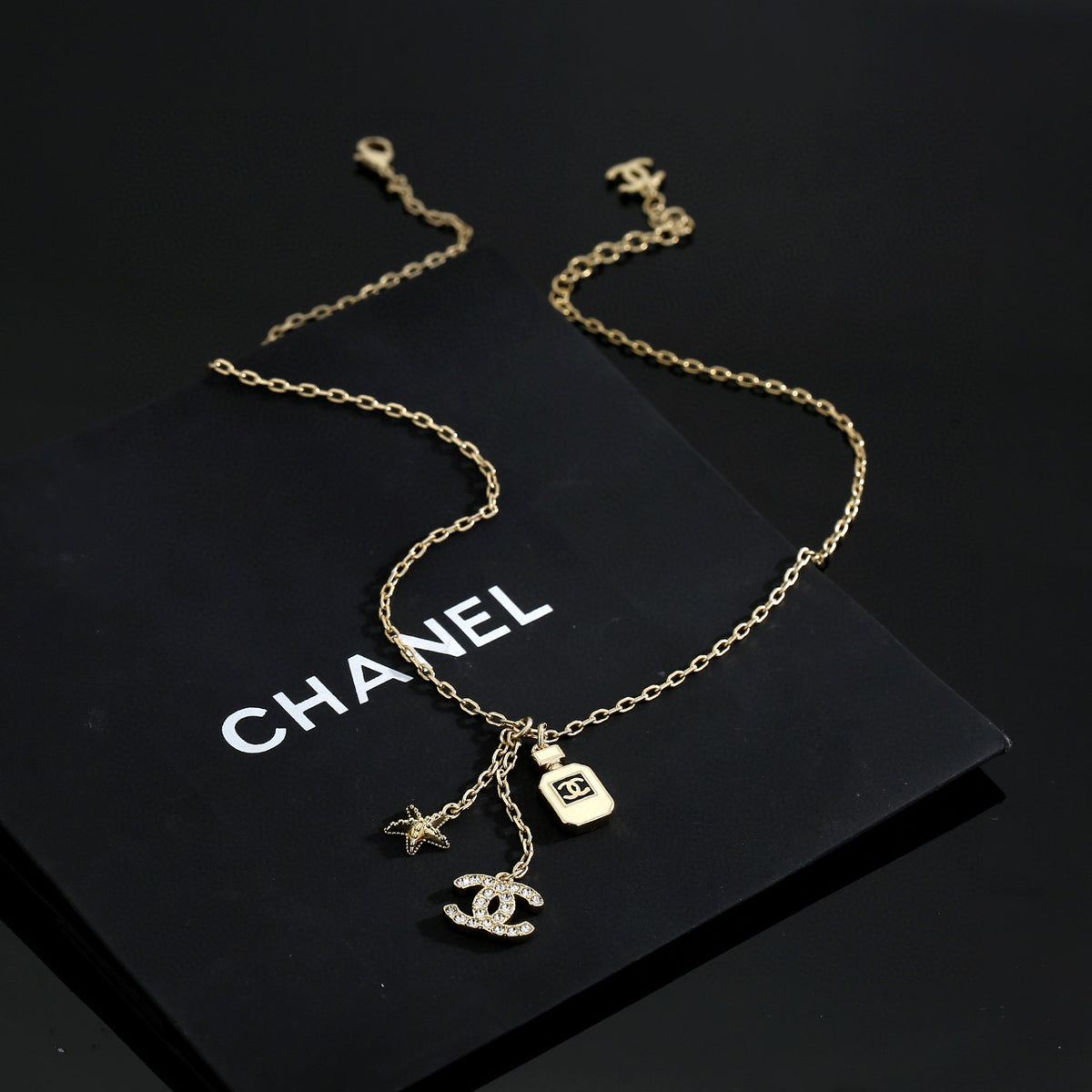 Double-C Emblem Pendant Necklace in Polished Metal-Tone – Design 010 detail view