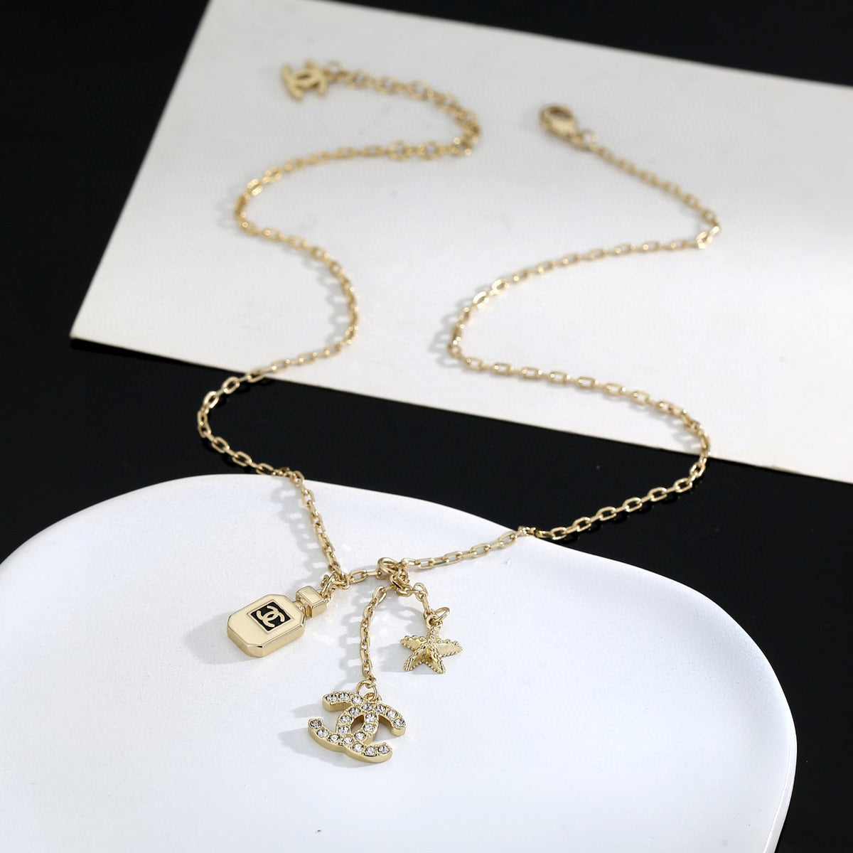 Double-C Emblem Pendant Necklace in Polished Metal-Tone – Design 010 main product view