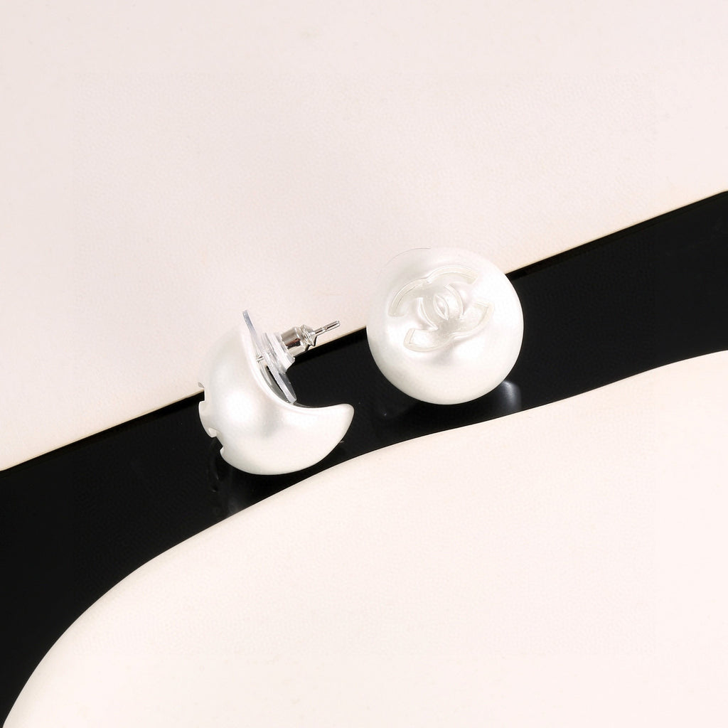 Double-C Emblem Stud Earrings in Polished Metal-Tone – White Detail detail view