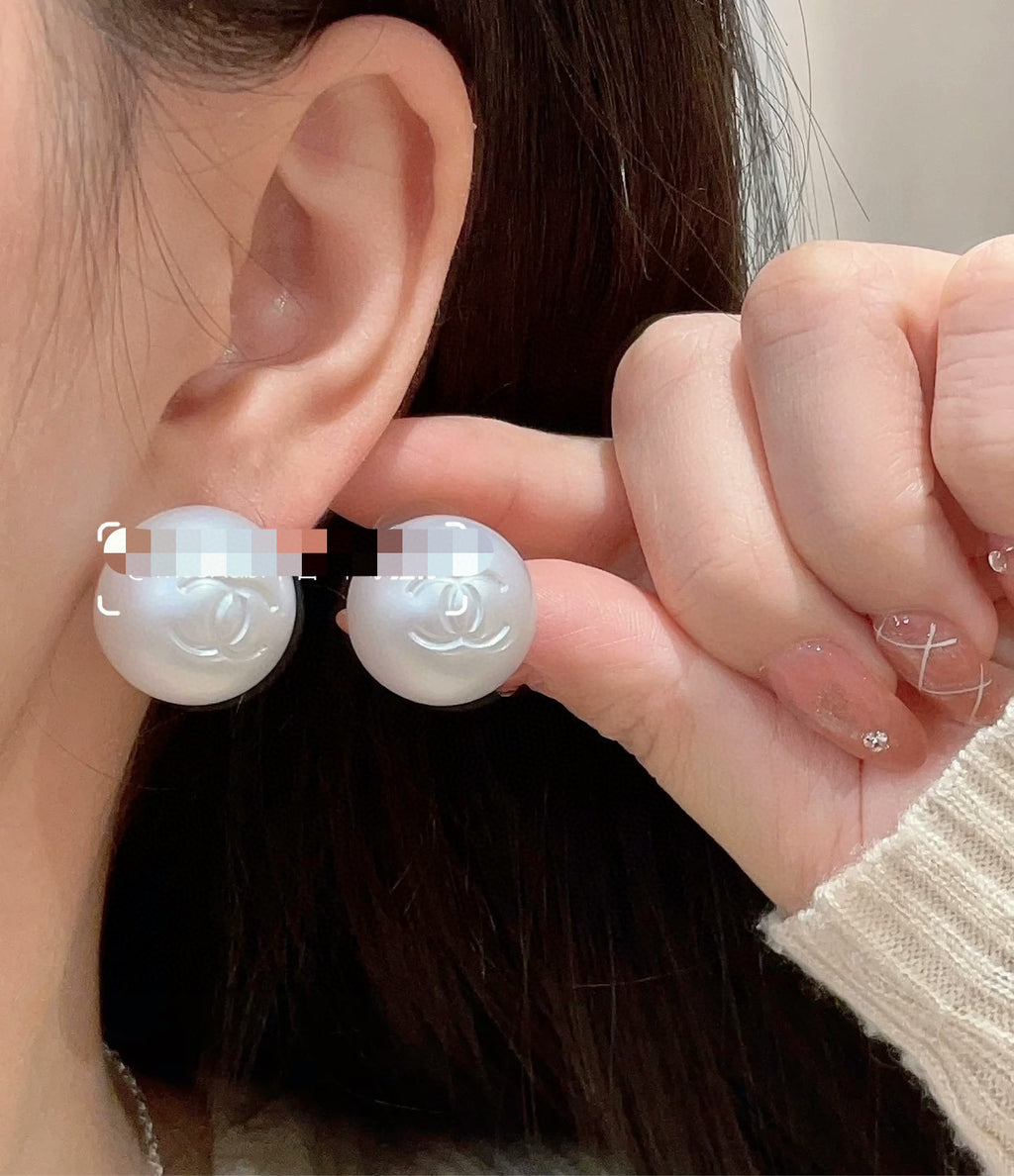Double-C Emblem Stud Earrings in Polished Metal-Tone – White Detail styled product view