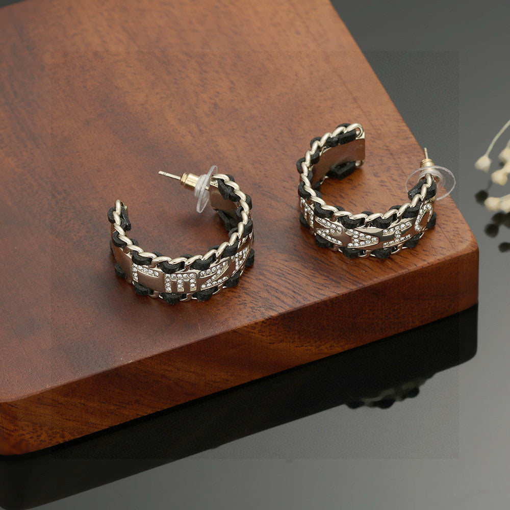 Signature Emblem Stud Earrings in Silver-Tone – Black Detail front product view