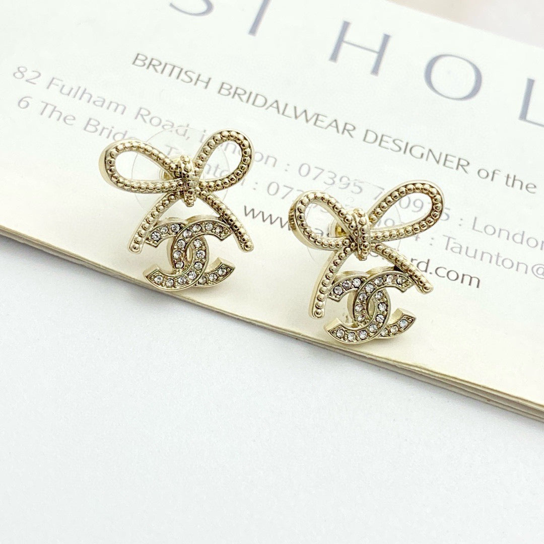 Double-C Emblem Stud Earrings in Polished Metal-Tone – Design 115 close-up detail