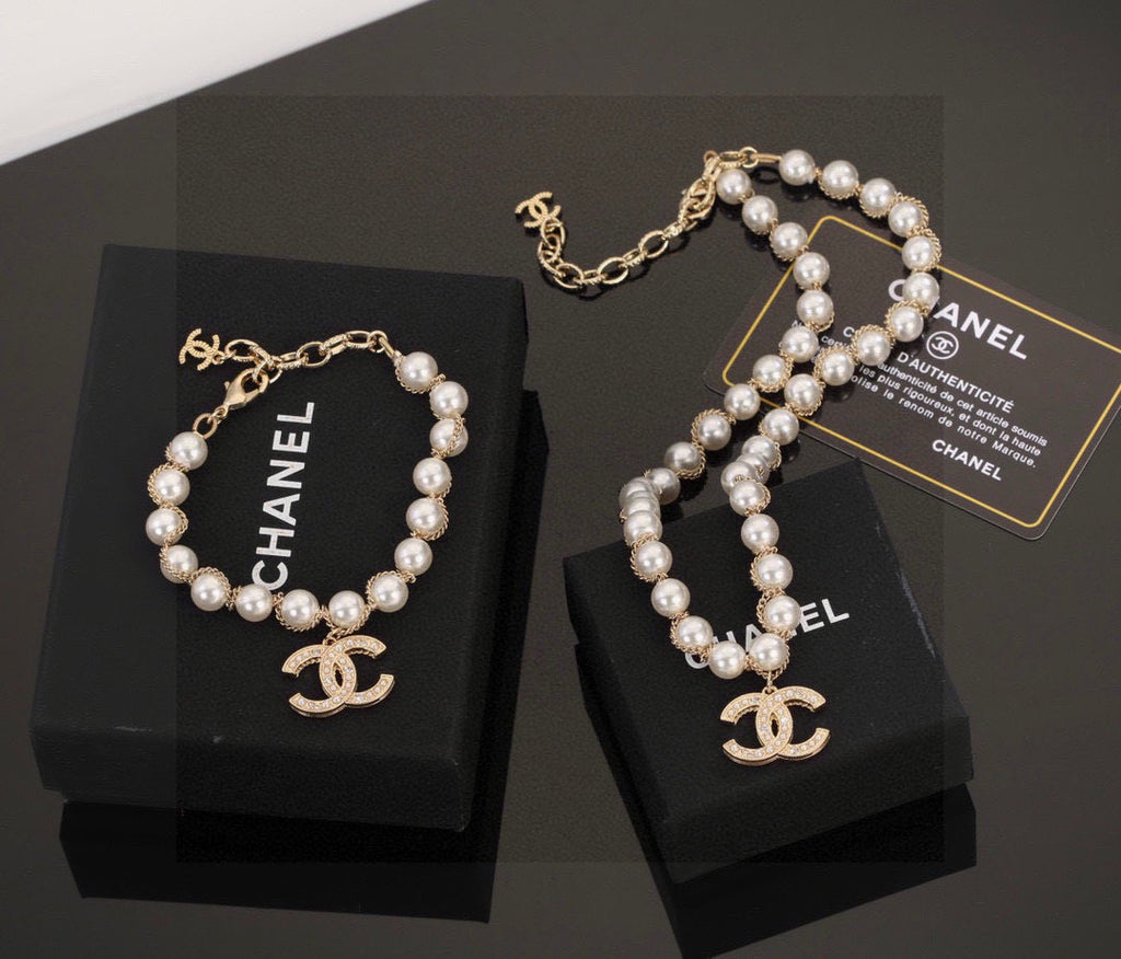 Double-C Emblem Bracelet in Polished Metal-Tone – Pearl Detail main product view