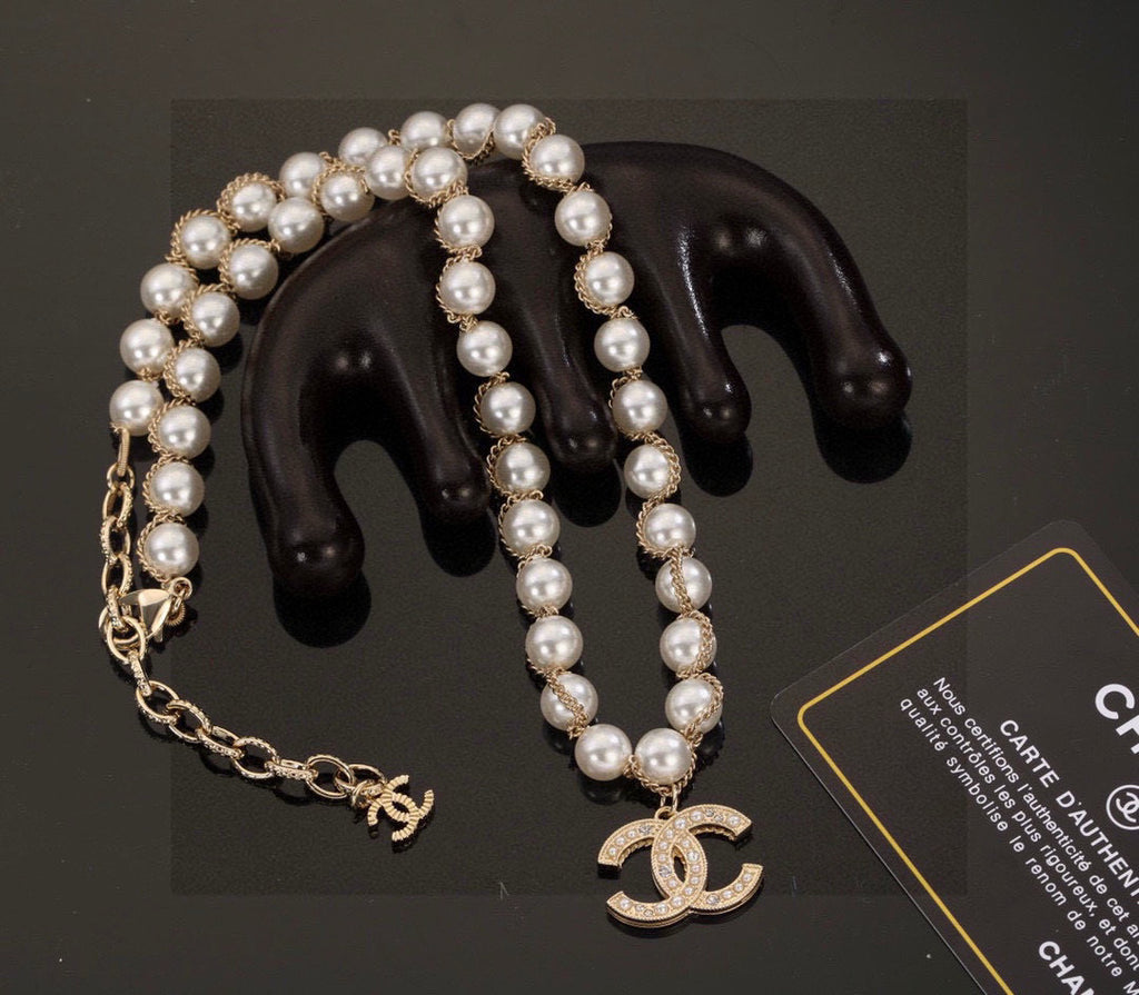 Double-C Emblem Bracelet in Polished Metal-Tone – Pearl Detail main product view