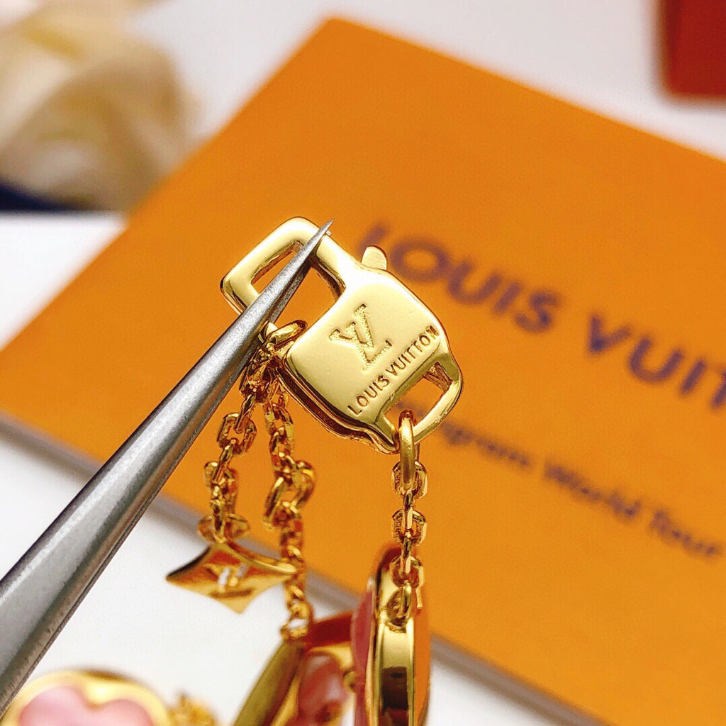 Geometric Emblem Bracelet in Gold-Tone – Pink Detail styled product view