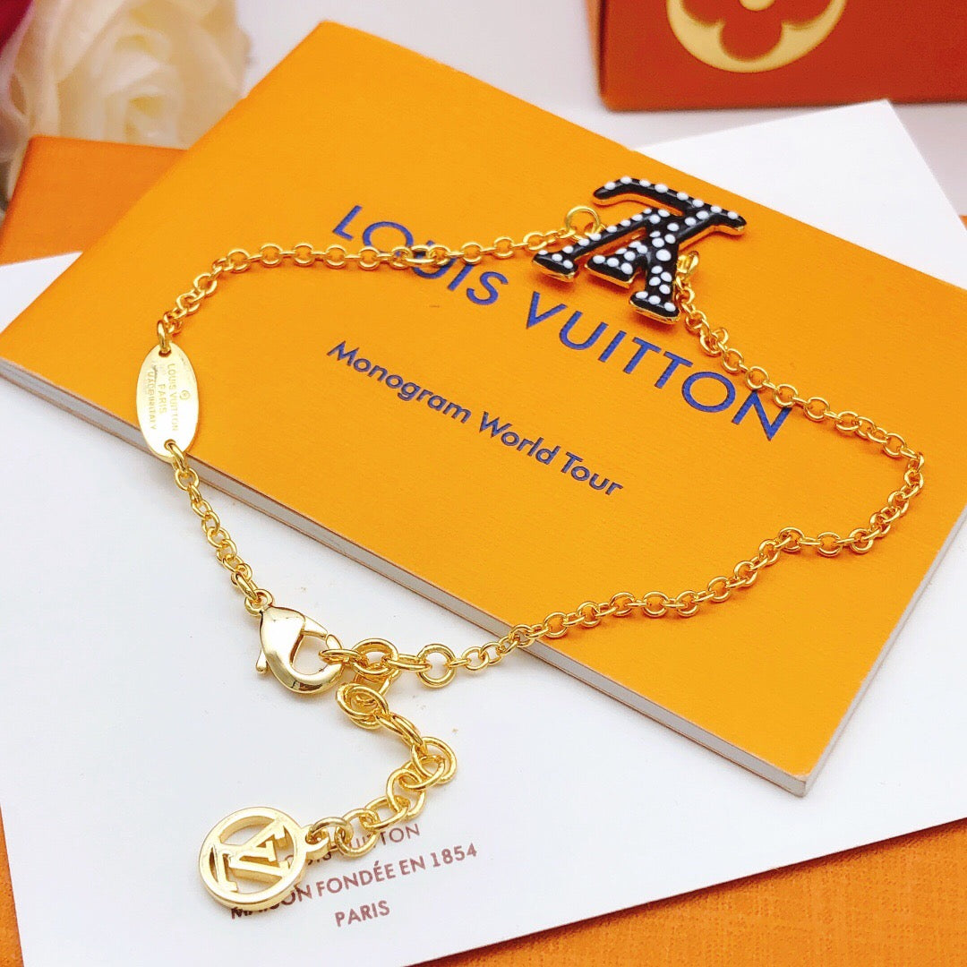 Geometric Emblem Bracelet in Gold-Tone – Black Detail detail view