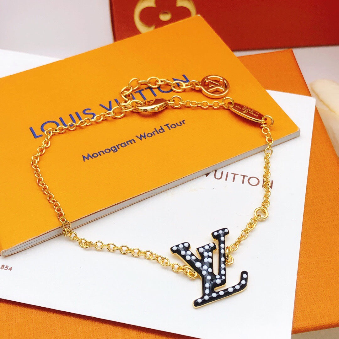 Geometric Emblem Bracelet in Gold-Tone – Black Detail close-up detail