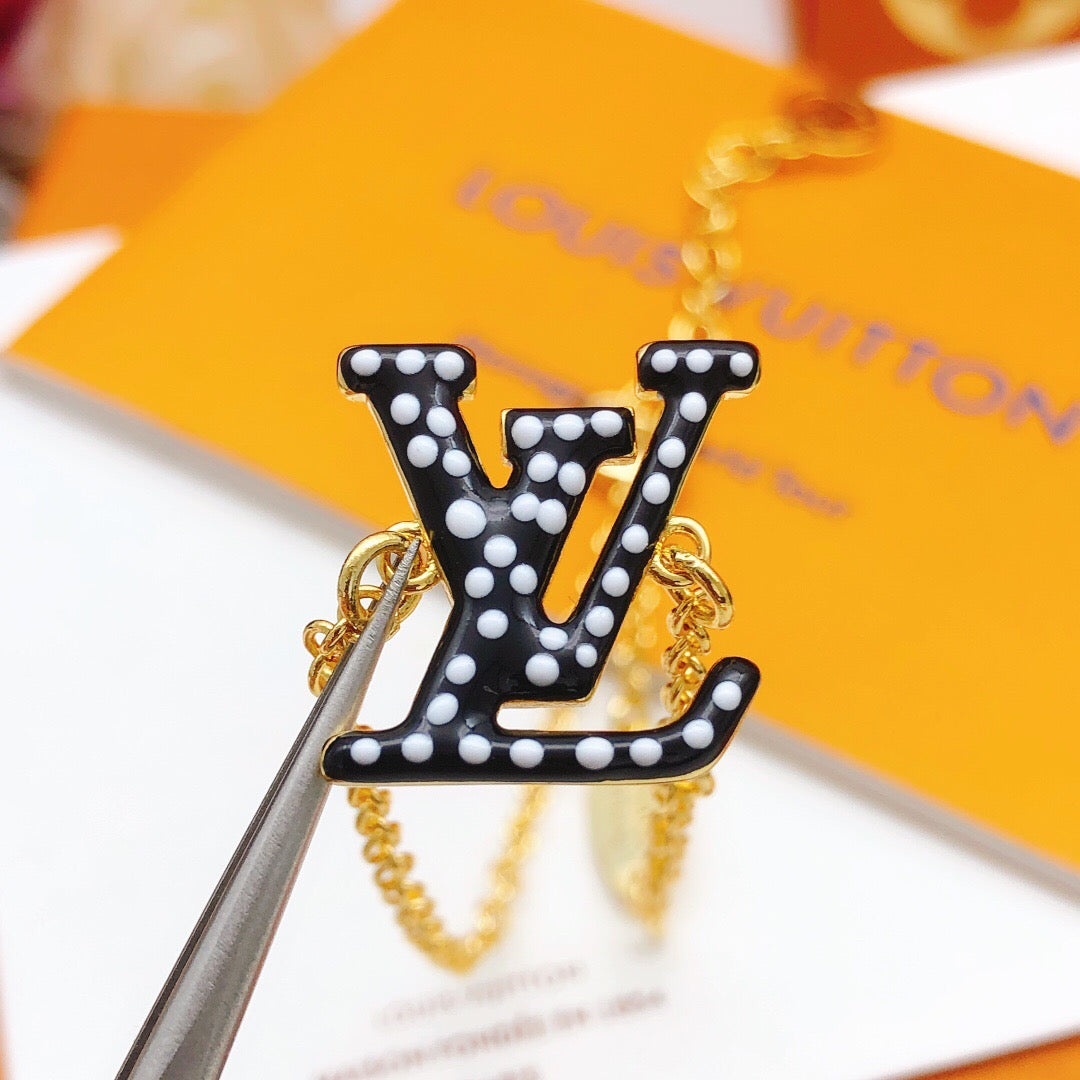 Geometric Emblem Bracelet in Gold-Tone – Black Detail side detail