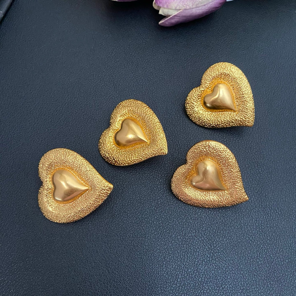 Saint Laurent Heart Statement Earrings in Polished Metal-Tone styled product view
