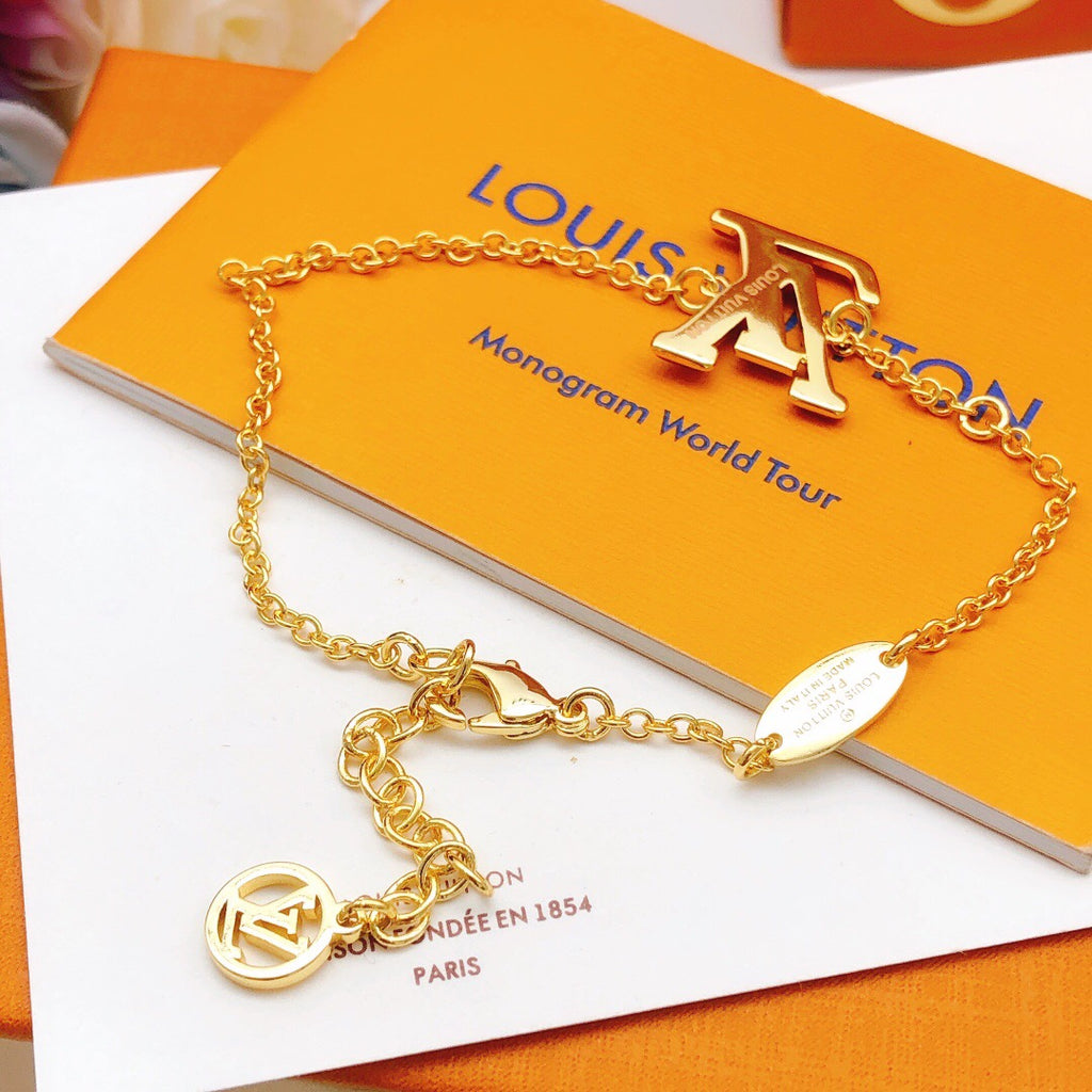 Geometric Emblem Bracelet in Gold-Tone – Red Detail detail view
